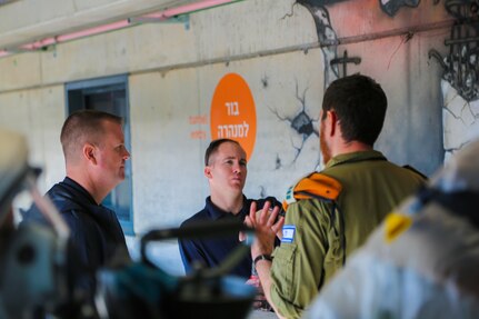 LTC Brian Hatcher, Commander, 7th CST (left), and SFC Nicolas Allee, 7th CST, discuss CBRNE operations with Home Front Command liaison after a training event showcasing HFC’s capabilities after a simulated terrorist attack.