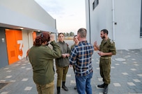 Sgt. 1st. Class Nicholas Allee, 7th CST, listens to Soldiers from the Israeli HFC explain CBRRNE tactics and responses.