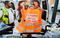 A first responder from Israel’s Magen David Adom (MADA, Israel's national ambulance service), shows her safety vest that has her name, unit and title on it. These vests makes it easier for first responders to identify one another during an emergency.