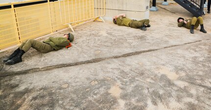 Israeli HFC Soldiers participate in a simulated chemical attack. The training event took place at a vacant football stadium in a Tel Aviv, Israel, December 6, 2022.