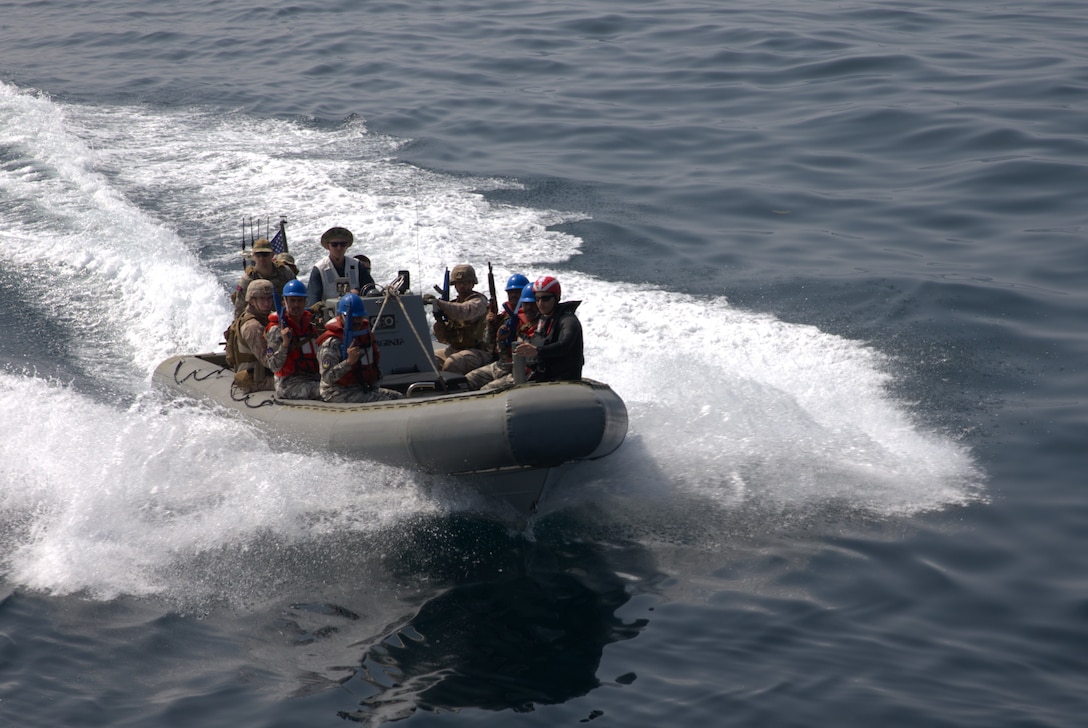 ARABIAN GULF (March 14, 2023) U.S. Marines, United Kingdom Royal Marine Commandos, and members of the Yemen Coast Guard approach U.S. Coast Guard fast response cutter USCGC Robert Goldman (WPC 1142) in a rigid-hull inflatable boat during visit, board, search and seizure training in the Arabian Gulf, March 14, 2023, during International Maritime Exercise 2023. IMX/CE 2023 is the largest multinational training event in the Middle East, involving 7,000 personnel from more than 50 nations and international organizations committed to preserving the rules-based international order and strengthening regional maritime security cooperation. (U.S. Army photo by Spc. Bryan Clay)