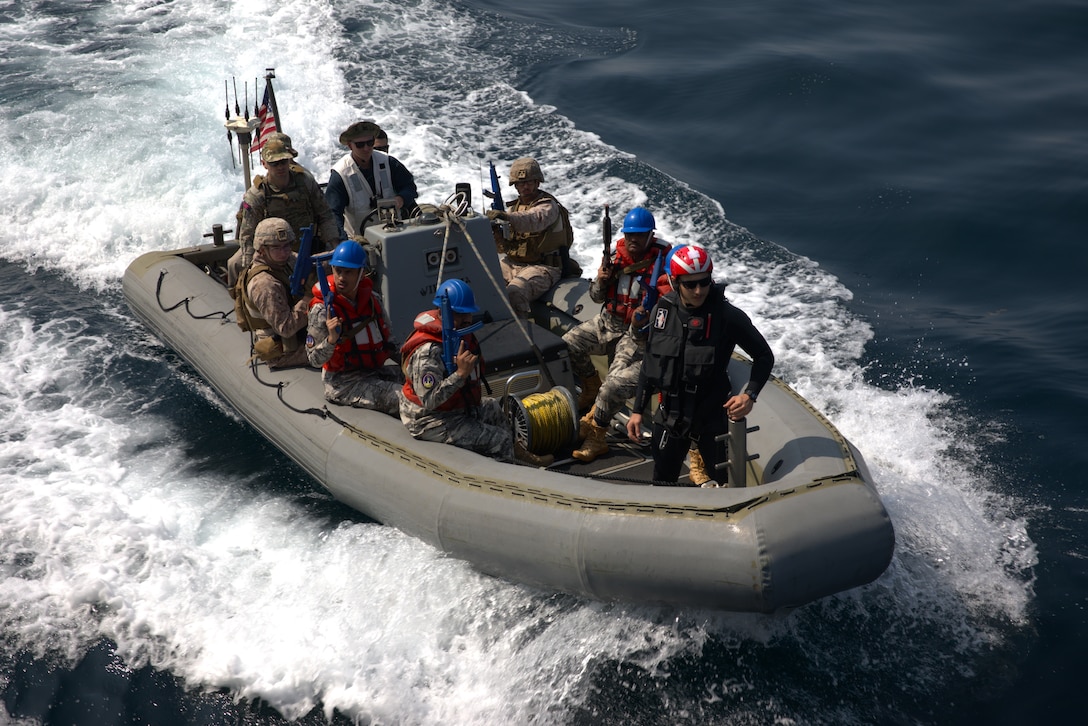 ARABIAN GULF (March 14, 2023) U.S. Marines, United Kingdom Royal Marine Commandos, and members of the Yemen Coast Guard approach U.S. Coast Guard fast response cutter USCGC Robert Goldman (WPC 1142) in a rigid-hull inflatable boat during visit, board, search and seizure training in the Arabian Gulf, March 14, 2023, during International Maritime Exercise 2023. IMX/CE 2023 is the largest multinational training event in the Middle East, involving 7,000 personnel from more than 50 nations and international organizations committed to preserving the rules-based international order and strengthening regional maritime security cooperation. (U.S. Army photo by Spc. Bryan Clay)