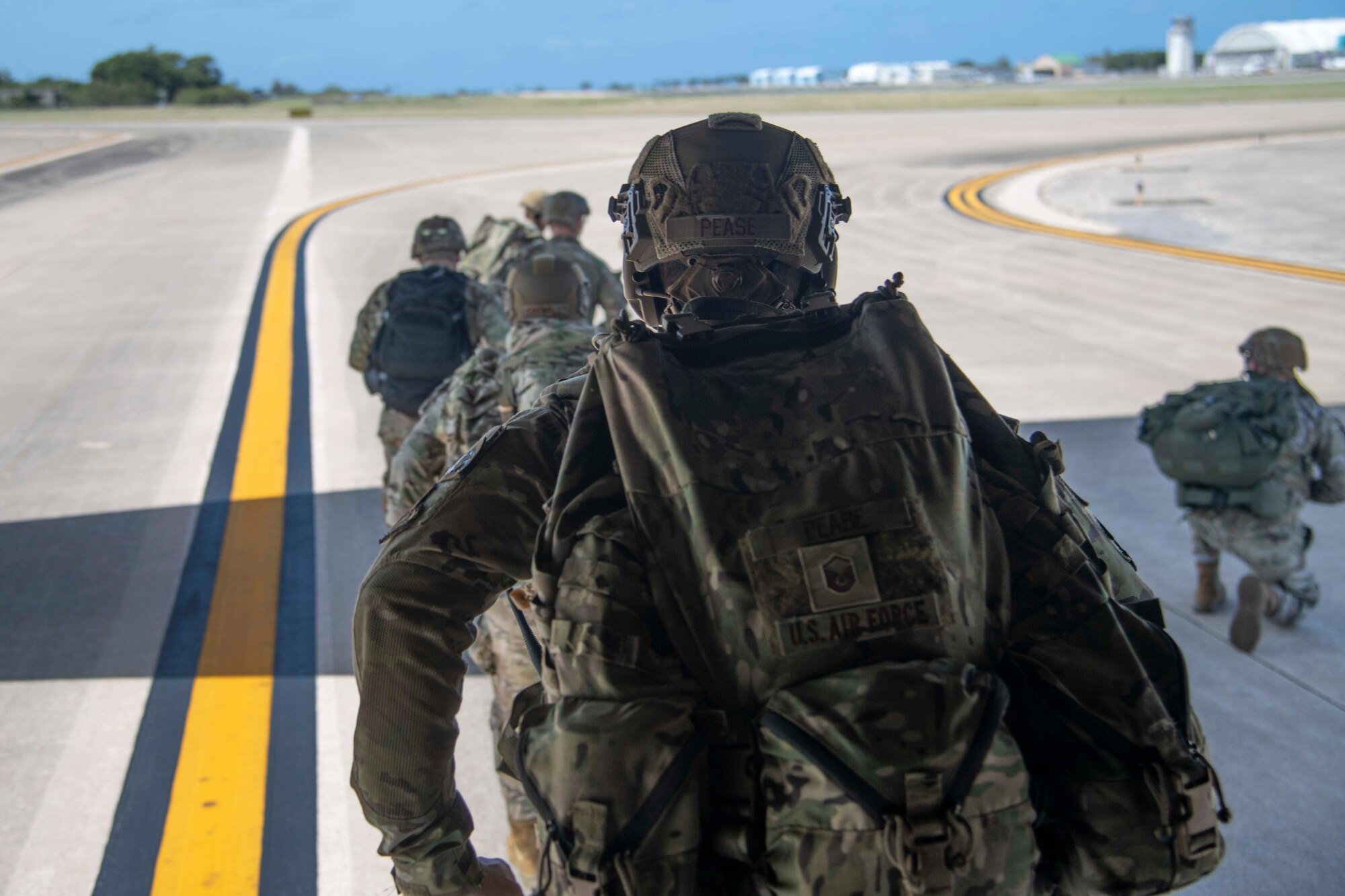 U.S. Air Force Airmen from the 820th Base Defense Group and a U.S. Army soldier run out of the back of a C-130J Super Hercules to perform a simulated airfield seizure at the Rafael Hernández International Airport, Puerto Rico, Feb. 25, 2023. These forces were supporting Operation Forward Tiger, an Air Forces Southern exercise designed to increase combat readiness alongside humanitarian assistance and disaster response capabilities with U.S. partners and allies throughout the Caribbean. (U.S. Air Force photo by 1st Lt. Christian Little)