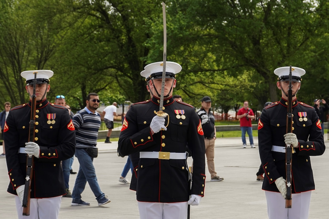 A Marine with Bravo Company, Marine Barracks Washington, renders a sword salute during an Honor Flight Network performance at the Lincoln Memorial, Washington, D.C. April 25, 2022. The Honor Flight Network transports veterans to Washington, D.C. to visit memorials in honor of their service to the country. (U.S. Marine Corps photo by Lance Cpl. Pranav Ramakrishna)