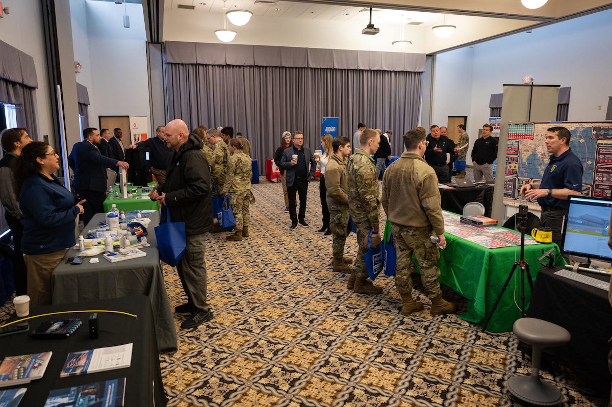 Team Dover Airmen interact with Department of Defense and civilian representatives during the 2023 Dover Air Force Base Tech Expo at Dover AFB, Delaware, March 15, 2023. The event provided Airmen the opportunity to meet face to face with leading tech companies. (U.S. Air Force photo by Senior Airman Cydney Lee)