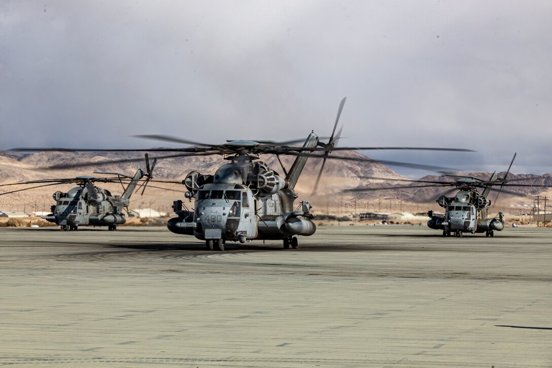 U.S. Marines Corps CH-53E Super Stallions with Heavy Marine Helicopter Squadron 466, Marine Aircraft Group 16, 3rd Marine Aircraft Wing, conduct flight operations during Marine Air-Ground Task Force Warfighting Exercise (MWX) 2-23 at Marine Corps Air Ground Combat Center, Twentynine Palms, California, Feb. 23, 2023. MWX is the culminating event of Service Level Training Exercise 2-23, that improves U.S. and allied service members’ operational capabilities. (U.S. Marine Corps Sgt. Armando Elizalde)