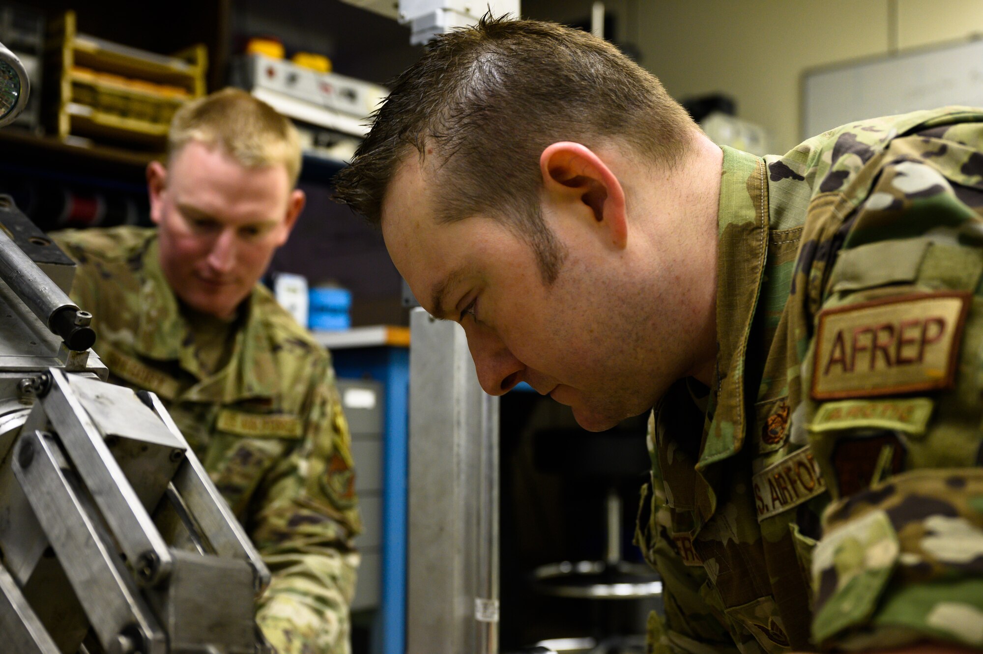 Airmen works on robot