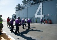 SAN DIEGO (March 8, 2023) – Sailors assigned to USS Boxer (LHD 4) respond to a mass casualty drill on the flight deck. Boxer, Fleet Surgical Team Five and Navy Medicine Readiness and Training Command San Diego Sailors participated in a two-day mass casualty drill simulating Boxer as a casualty receiving treatment ship. Boxer is a Wasp-class amphibious assault ship homeported in San Diego. (U.S. Navy photo by Chief Mass Communication Specialist John Scorza)