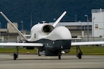In this file photo, A U.S. Navy MQ-4C Triton with Unmanned Patrol Squadron 19 (VUP-19) taxis at Marine Corp Air Station Iwakuni, Japan, Oct. 5, 2022. Due to its geographic location and co-located airfield and harbor, MCAS Iwakuni is uniquely postured to provide advanced naval integration in support of regional security.