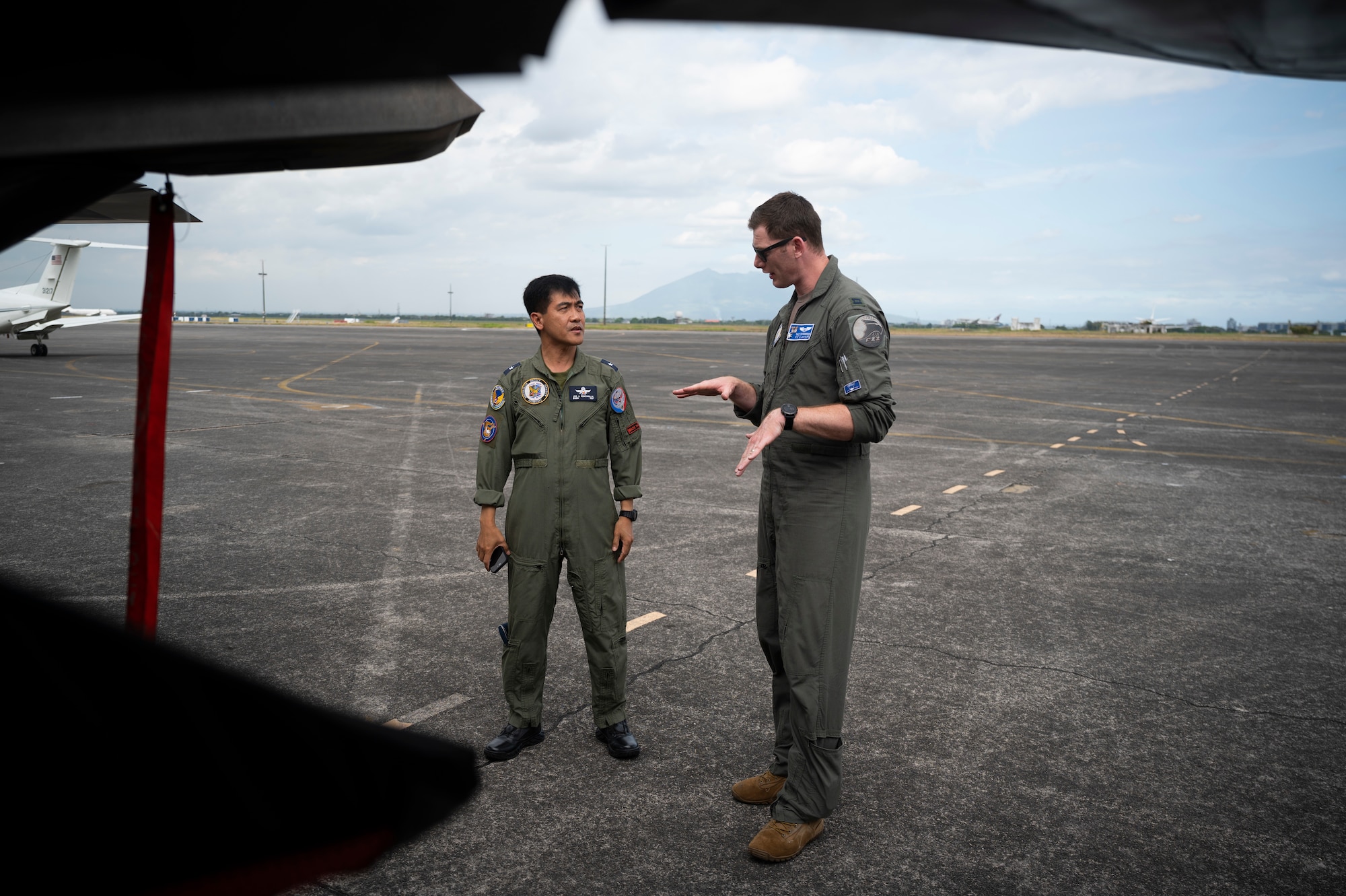 U.S. Air Force Capt. Karl Schroeder, 525th Fighter Squadron F-22A Raptor pilot, briefs Philippine Air Force Brig. Gen. Leo Fontanilla, 5th Fighter Wing commander, on the capabilities of the Raptor during a static aircraft tour at Clark Air Base, Philippines, March 13, 2023. Bilateral training and cooperation with our Philippine Air Force counterparts enhances the mutual readiness required to defend security, prosperity, and peace throughout the Indo-Pacific region. (U.S. Air Force photo by Senior Airman Jessi Roth)
