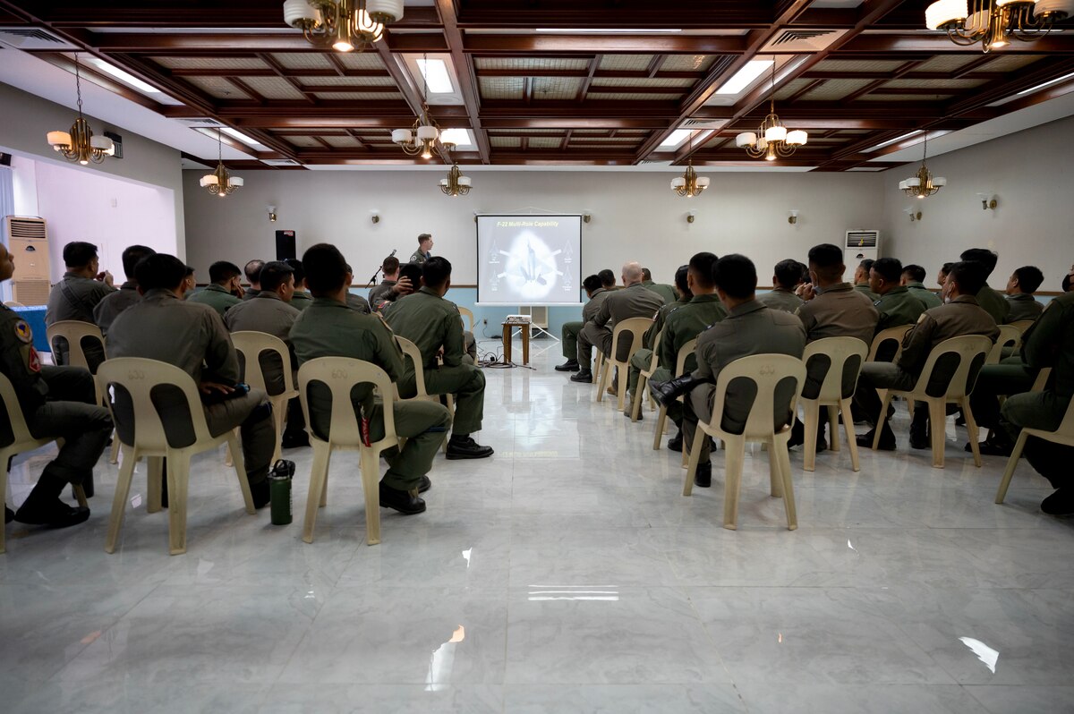 U.S. Air Force Capt. Joe Baumann, 525th Fighter Squadron F-22A Raptor pilot, discusses aircraft capabilities with members of the Philippine Air Force during a Subject Matter Expert Exchange at Clark Air Base, Philippines, March 13, 2023. These exchanges promote interoperability and build upon the foundation of a strong U.S.-Philippines alliance while reaffirming the PACAF commitment to the Indo-Pacific region. (U.S. Air Force photo by Senior Airman Jessi Roth)