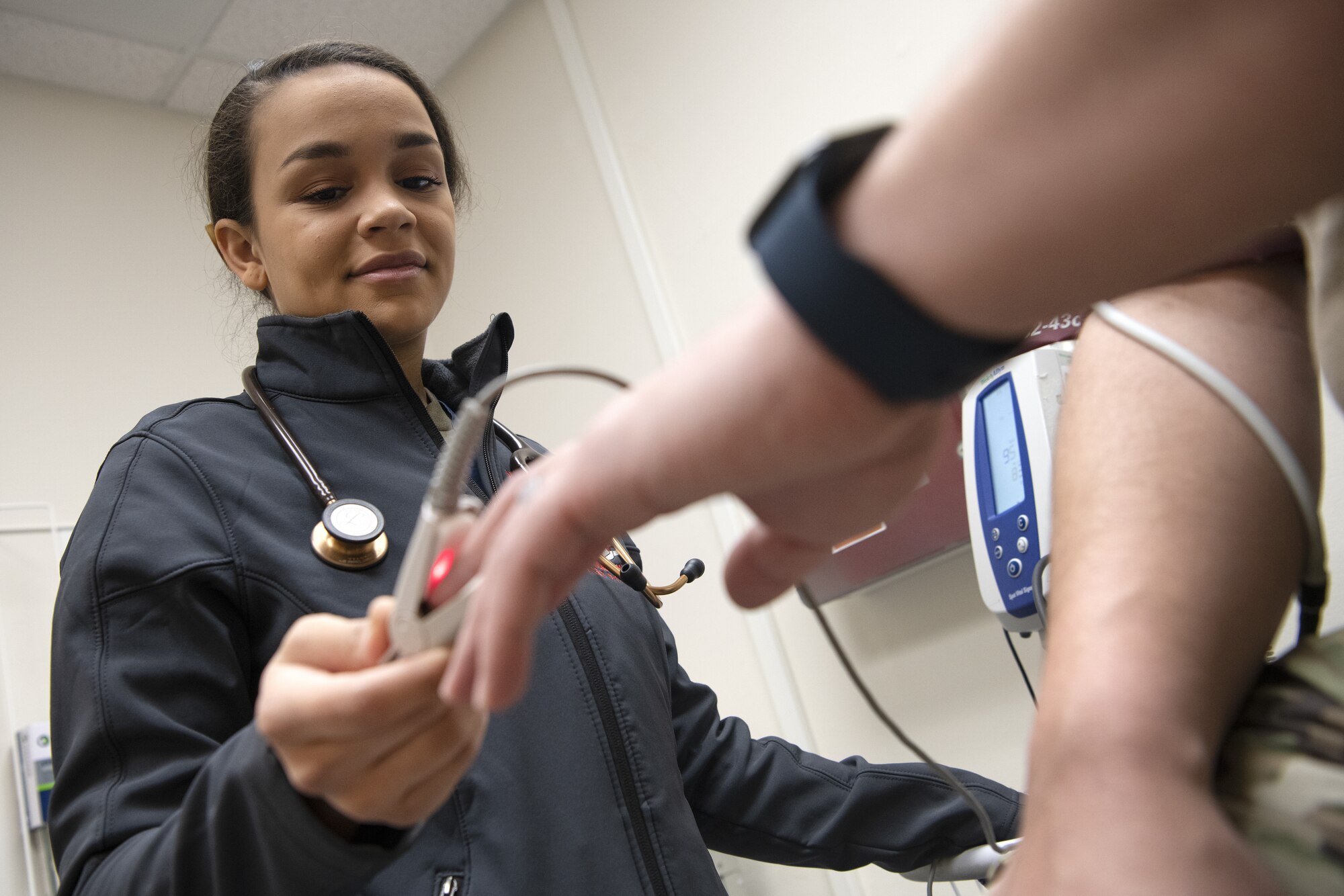 Airman 1st Class Jasmine Wilkerson checks a patient’s vitals at the Internal Medicine Clinic at Yokota Air Base, Japan.