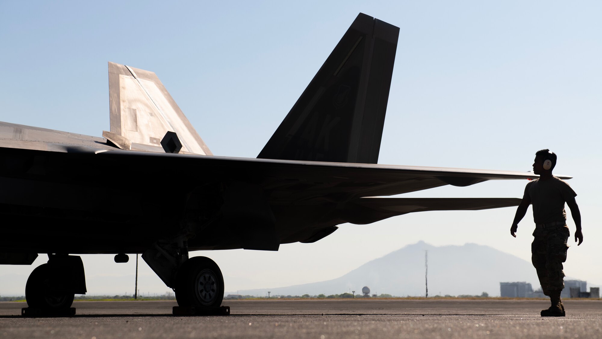 U.S. Air Force Senior Airman Randy Siri, 3rd Aircraft Maintenance Squadron crew chief, conducts pre-flight checks on an F-22A Raptor prior to a bilateral training flight out of Clark Air Base, Philippines, March 14, 2023. Enhancing interoperability between the U.S. and Philippine air forces contributes to the long-term advancement of our nations’ shared interest in maintaining a free and open Indo-Pacific. (U.S. Air Force photo by Senior Airman Jessi Roth)