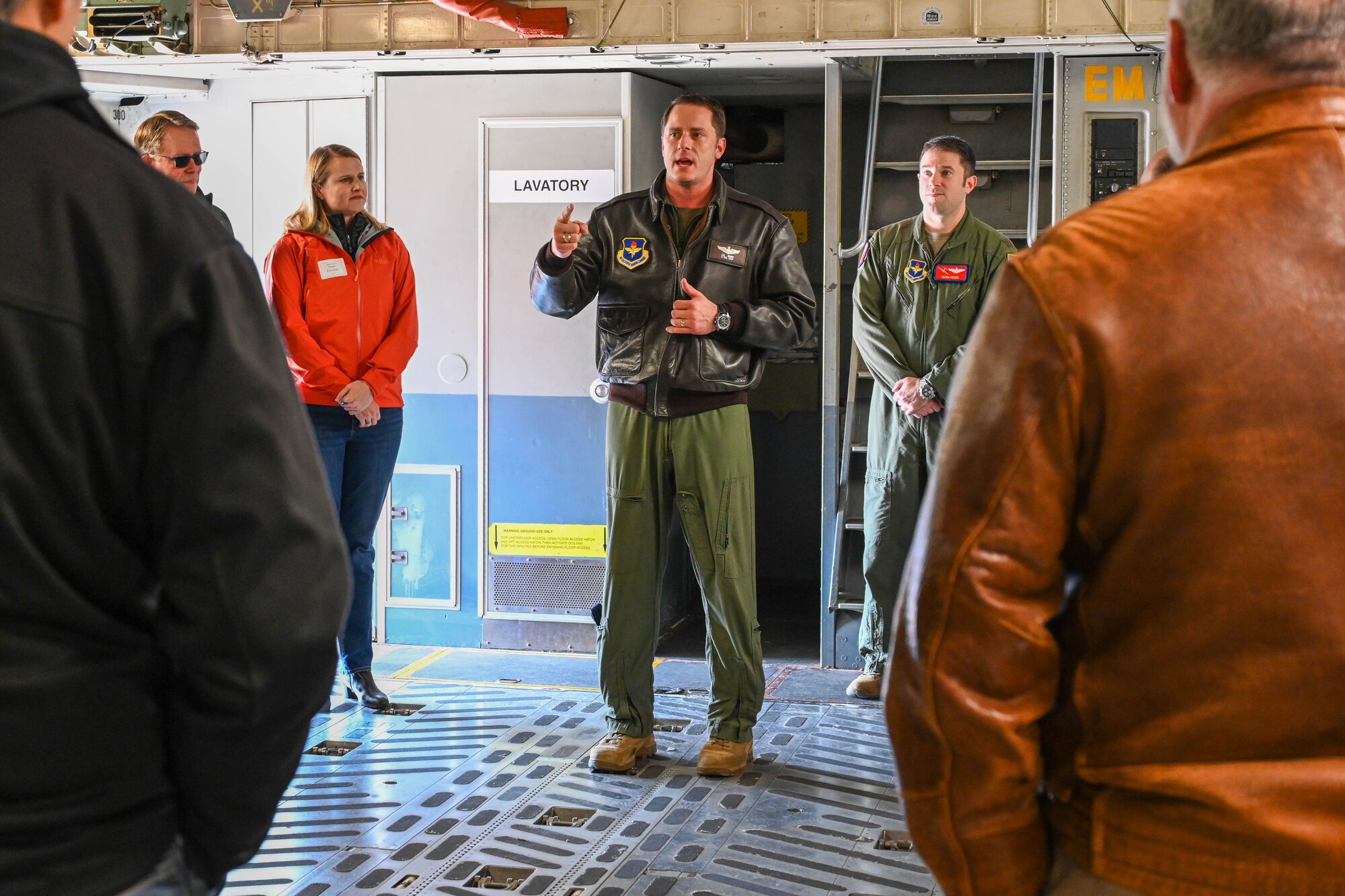 U.S. Air Force Lt. Col. John Shaw, 58th Airlift Squadron director of operations, educates the tour participants about the C-17 Globemaster III to members of Leadership Oklahoma at Altus Air Force Base (AFB), Oklahoma, March 14, 2023. Shaw gave an overview of C-17 capabilities and training, including some of the day-to-day operations that occur at Altus AFB. (U.S. Air Force photo by Senior Airman Trenton Jancze)