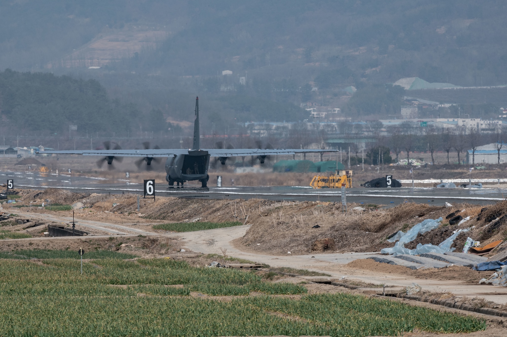 Photo of Airmen, Aircraft, operating on an alternate landing strip