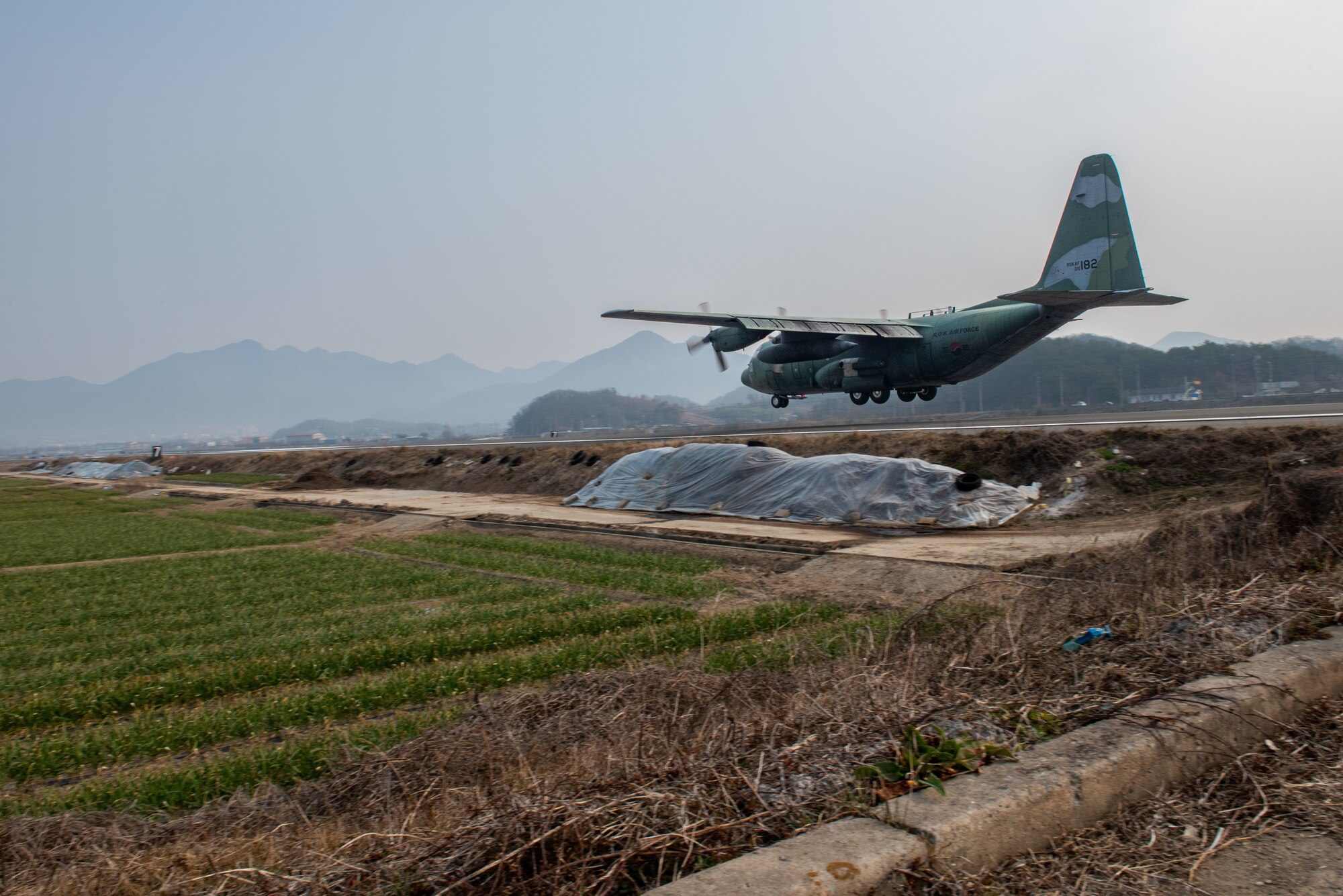 Photo of Airmen, Aircraft, operating on an alternate landing strip