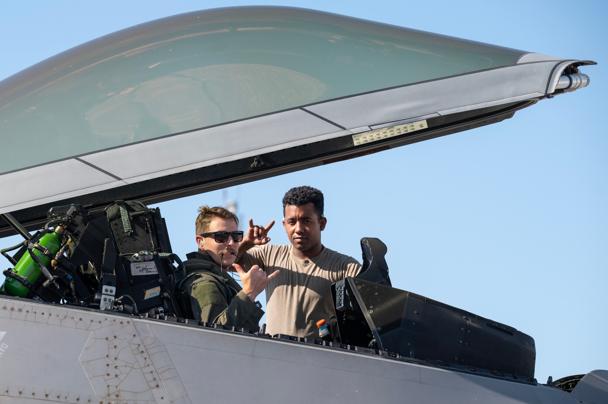 U.S. Air Force Capt. Joe Baumann, 525th Fighter Squadron F-22A Raptor pilot, and Senior Airman Randy Siri, 3rd Aircraft Maintenance Squadron crew chief, pose for a photo prior to departure from Clark Air Base, Philippines, March 14, 2023. Bilateral training and cooperation with our Philippine Air Force counterparts enhances the mutual readiness required to defend security, prosperity, and peace throughout the Indo-Pacific region. (U.S. Air Force photo by Senior Airman Jessi Roth)