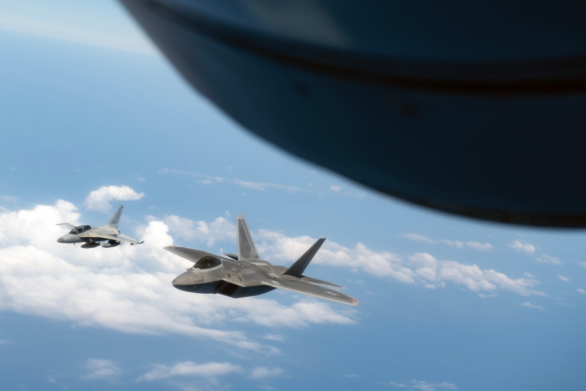 An F-22A Raptor assigned to the 525th Fighter Squadron flies side by side with a Philippine Air Force FA-50PH over the South China Sea, March 14, 2023. Enhancing interoperability between the U.S. and Philippine air forces contributes to the long-term advancement of our nations’ shared interest in maintaining a free and open Indo-Pacific. (U.S. Air Force photo by Senior Airman Jessi Roth)