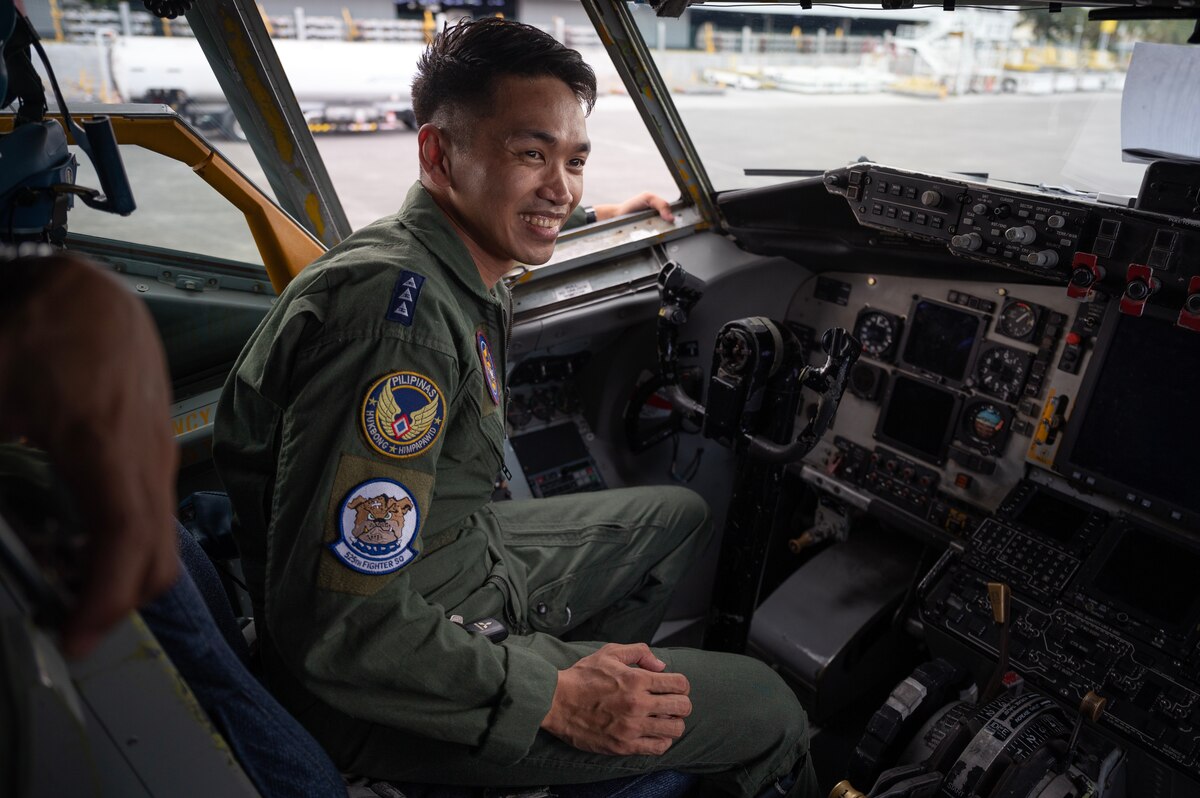 A Philippine Air Force pilot sits in the cockpit of a KC-135 Stratotanker assigned to the 909th Air Refueling Squadron during a static aircraft tour at Clark Air Base, Philippines, March 13, 2023. Bilateral training and cooperation with our Philippine Air Force counterparts enhances the mutual readiness required to defend security, prosperity, and peace throughout the Indo-Pacific region. (U.S. Air Force photo by Senior Airman Jessi Roth)