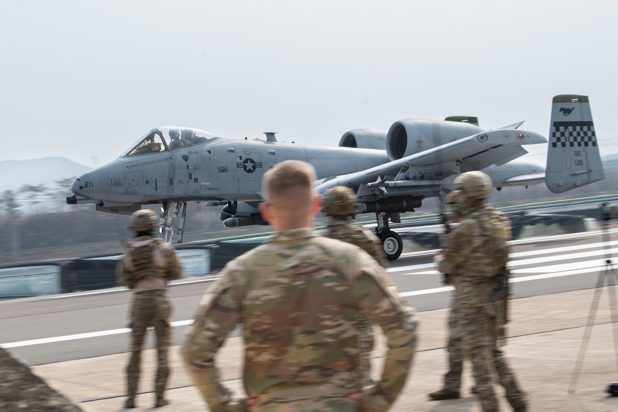 Photo of Airmen, Aircraft, operating on an alternate landing strip