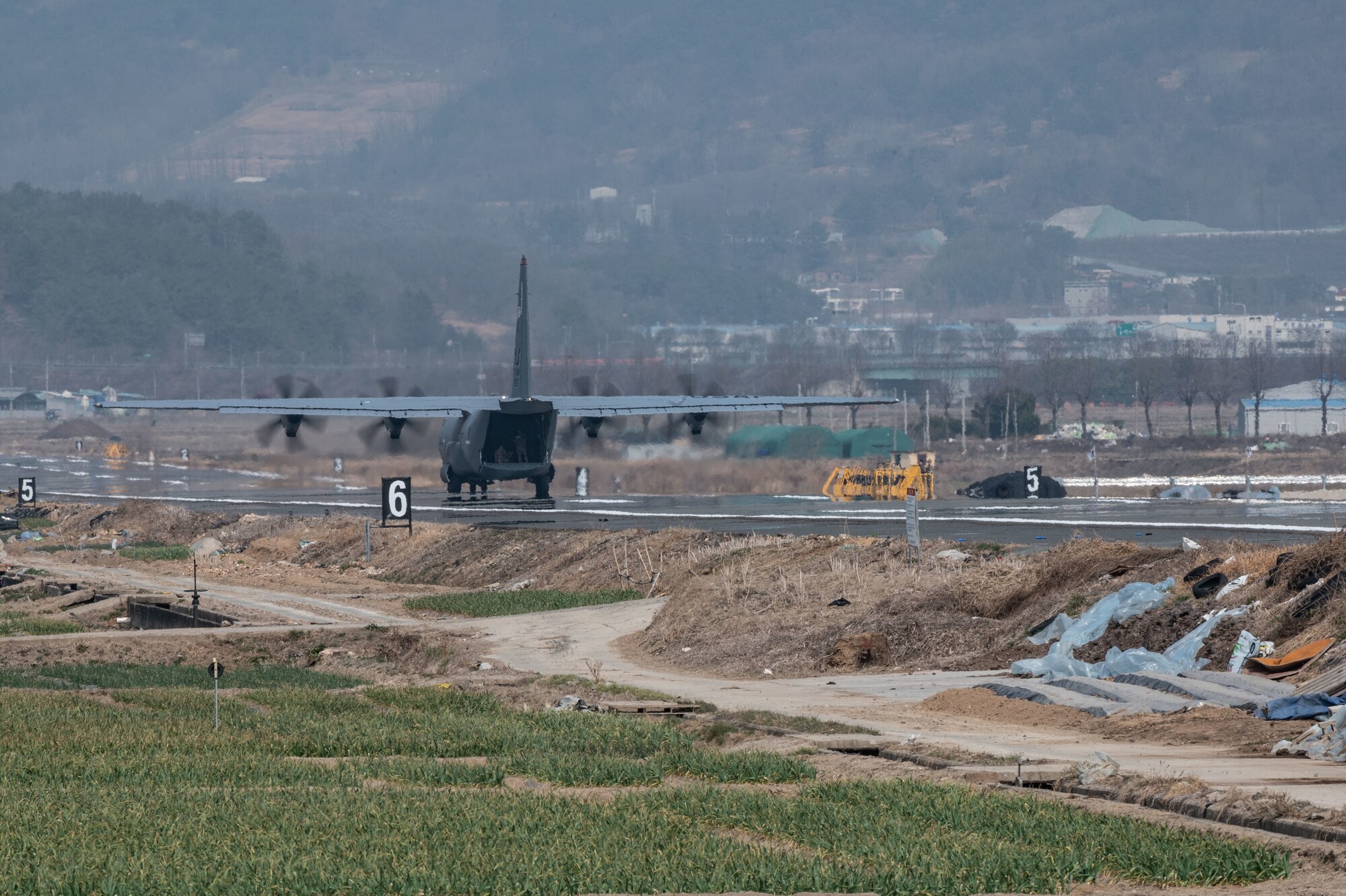 Photo of Airmen, Aircraft, operating on an alternate landing strip