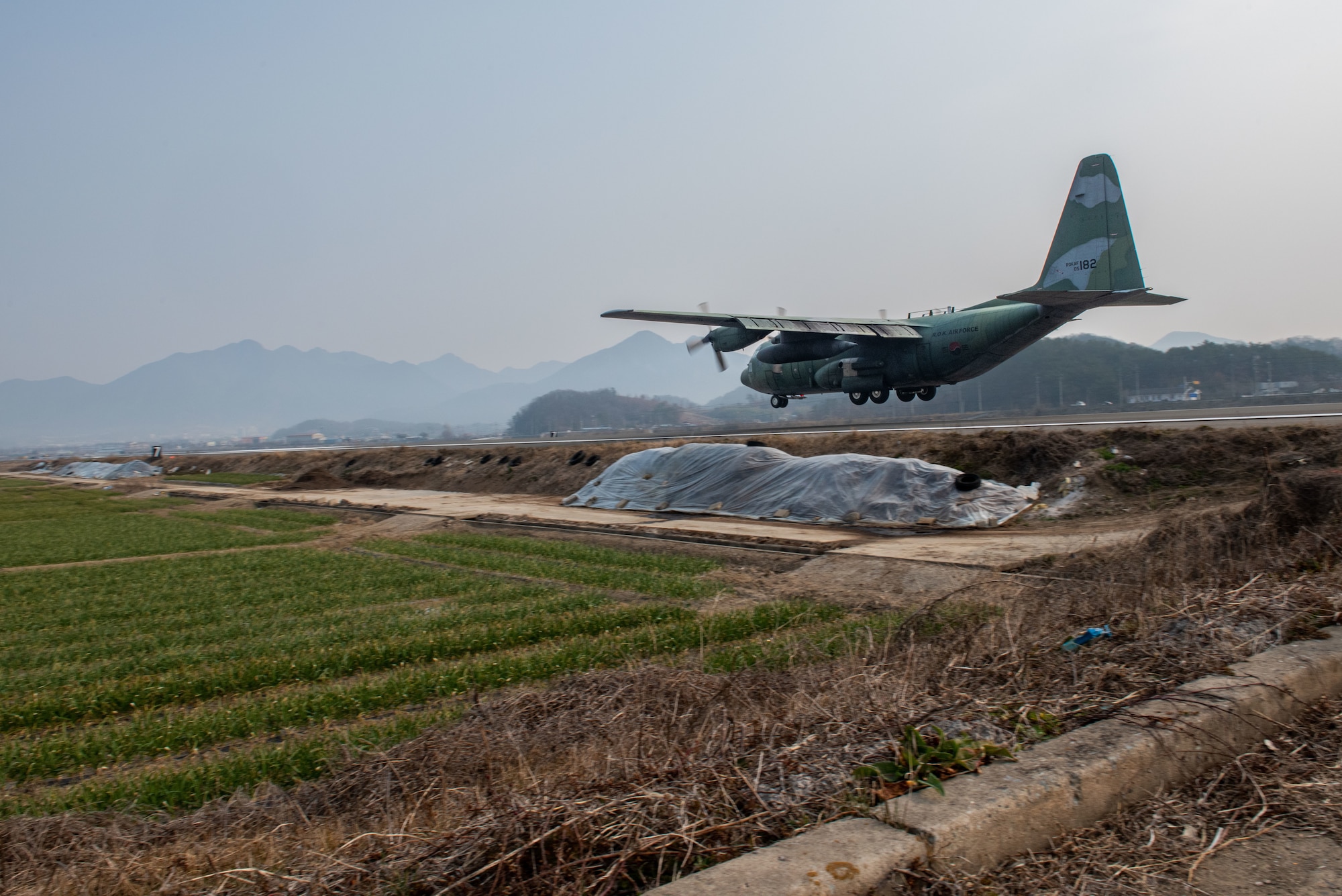 Photo of Airmen, Aircraft, operating on an alternate landing strip