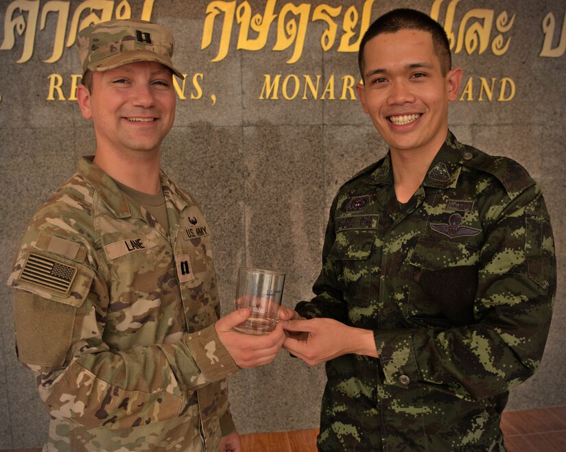 U.S. Army Capt. David Lane, assigned to the 17th Field Artillery Brigade, and Royal Thai Army Capt. Sittipat Maingiw, assigned to the 711th Field Artillery Battalion, reunited on March 7 in Lop Buri Province, Kingdom of Thailand, during Exercise Cobra Gold.