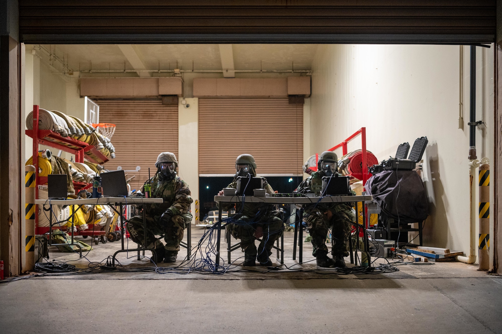 Airmen sit in chairs during exercise