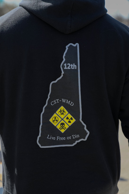 An unidentified Soldier with the New Hampshire National Guards 12th Civil Support teams displays his unit's sweatshirt during the site setup during the training event at Churchill Downs in Louisville, Ky., March 14, 202