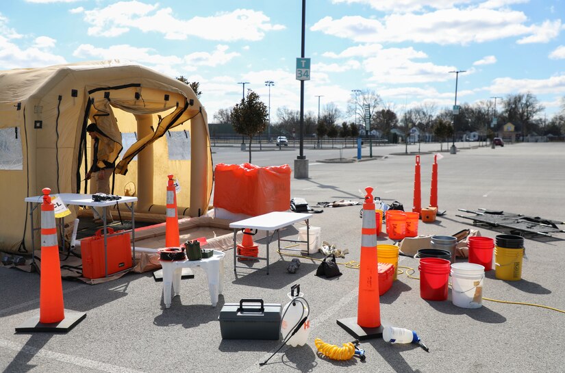 A decontamination tent is sent up in the parking lot in preparation for the training event at Churchill Downs in Louisville, Ky., March 13, 2023.