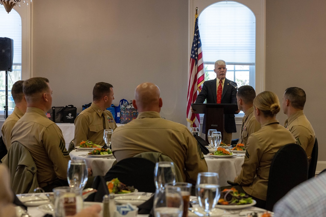 Retired U.S. Marine Corps Maj. Gen. Tom Braaten with the New Bern Chamber of Commerce Military Affairs Committee welcomes guests to the Service Person of the Quarter ceremony at the New Bern Golf and Country Club, North Carolina, March 9, 2023. The Service Person of the Quarter ceremony honored Cpl. Rachael Alboucq for her volunteer service on Marine Corps Air Station Cherry Point and in the surrounding community. (U.S. Marine Corps photo by Lance Cpl. Lauralle Walker)