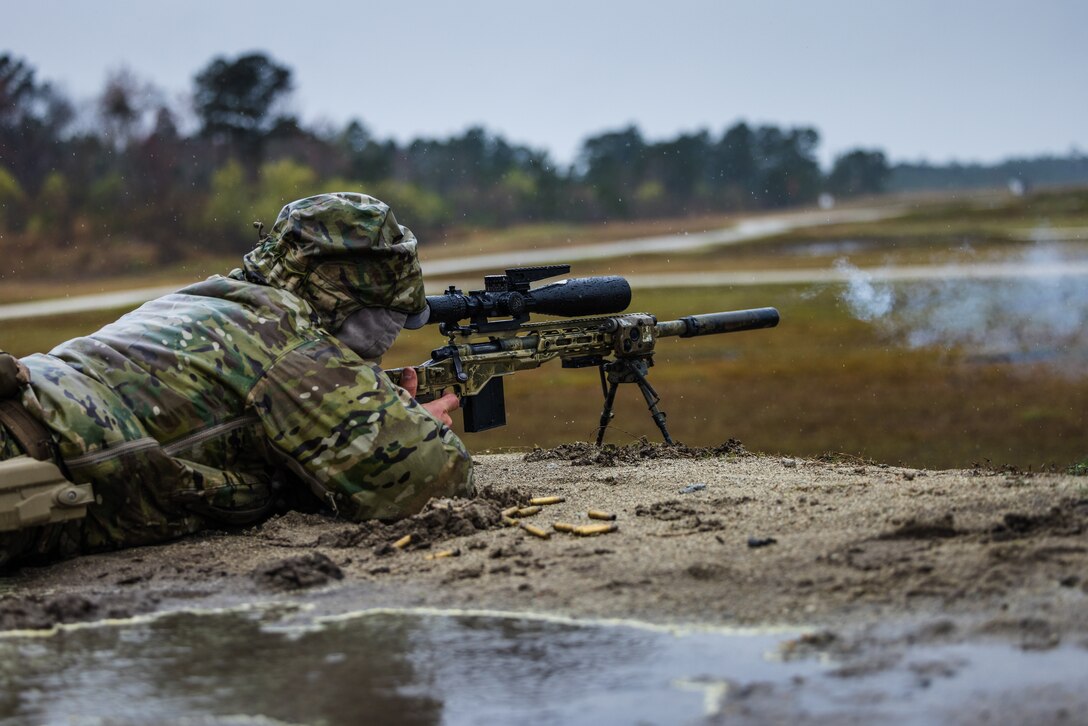 U.S. Marine Corps Sgt. Pierce Hutch, a reconnaissance Marine with 2d Reconnaissance Battalion, 2d Marine Division, fires a rifle on a sniper range during Exercise Caribbean Urban Warrior on Camp Lejeune, North Carolina, March 12, 2023. Exercise Caribbean Urban Warrior is a bilateral training evolution designed to increase global interoperability between 2d Marine Division and Marine Squadron Carib. (U.S. Marine Corps photo by Lance Cpl. Eric Dmochowski)