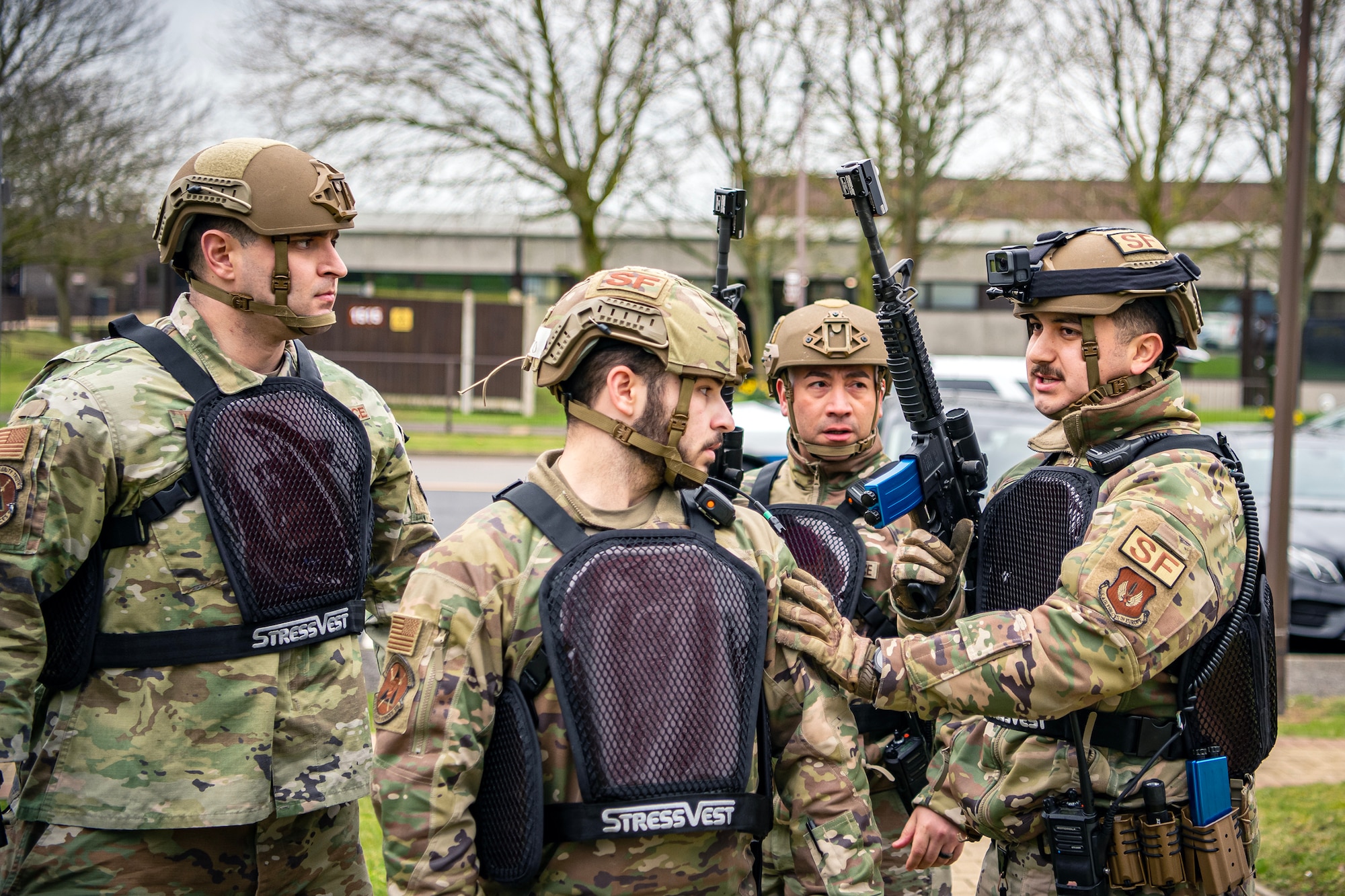 Airmen from the 423d Security Forces Squadron, discuss strategy during an exercise at RAF Alconbury, England, March 16, 2023. The exercise tested the 501st Combat Support Wing on overall readiness and ability to respond to an emergency situation. (U.S. Air Force photo by Staff Sgt. Eugene Oliver)