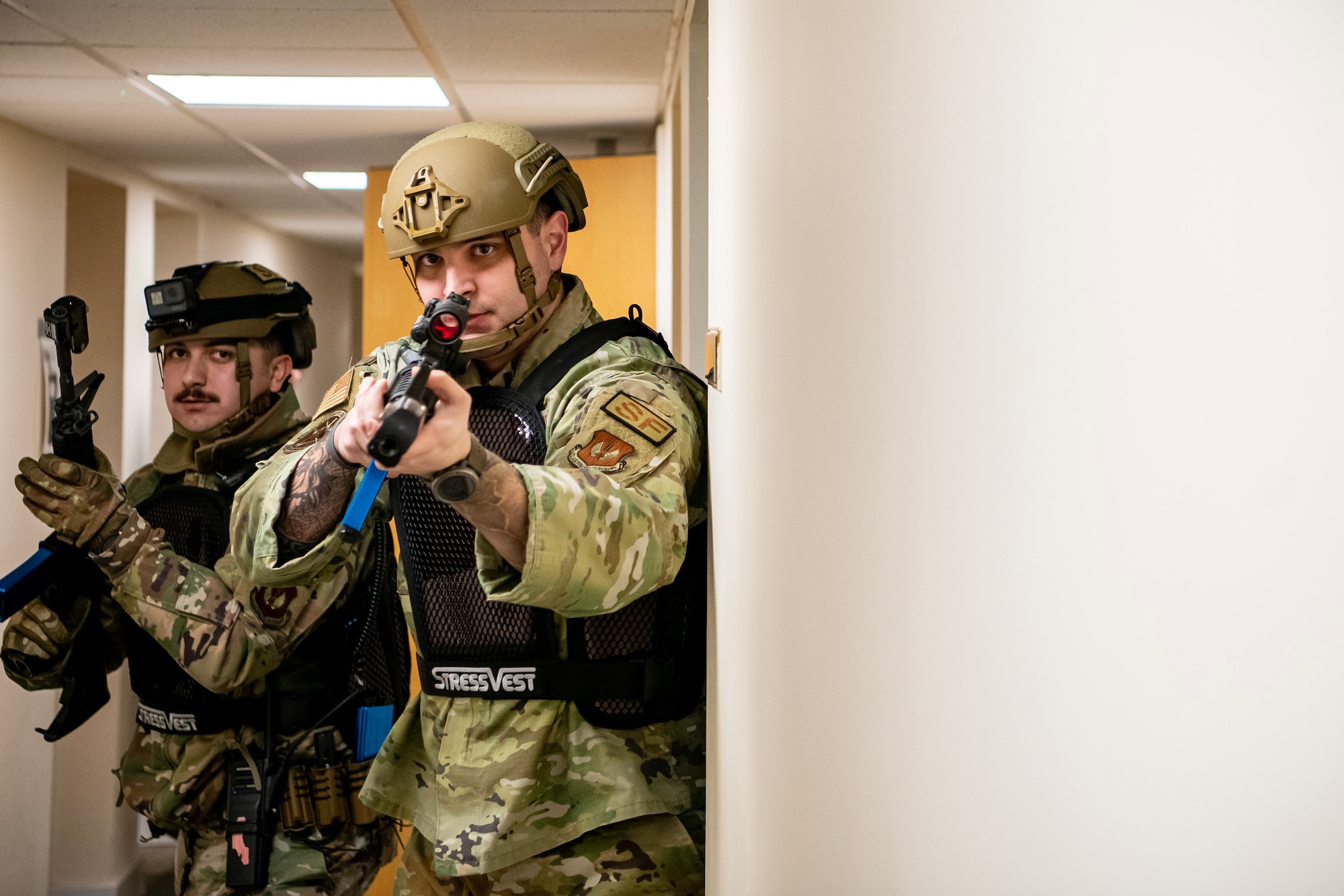 Airmen from the 423d Security Forces Squadron, execute a building sweep during an active shooter exercise at RAF Alconbury, England, March 16, 2023. The exercise tested the 501st Combat Support Wing on overall readiness and ability to respond to an emergency situation. (U.S. Air Force photo by Staff Sgt. Eugene Oliver)