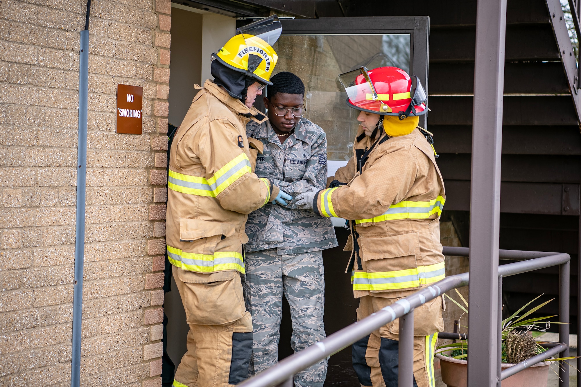 A Firefighter from the 423d Civil Engineer Squadron utilizes tactical combat casualty care on a simulated victim during an active shooter exercise at RAF Alconbury, England, March 16, 2023. The exercise tested the 501st Combat Support Wing on overall readiness and ability to respond to an emergency situation. (U.S. Air Force photo by Staff Sgt. Eugene Oliver)
