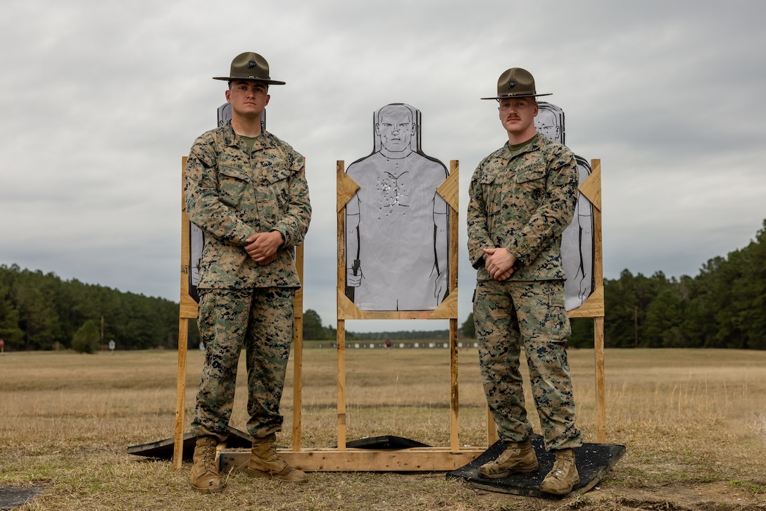 U.S. Marine Corps Sgt. Shane Ryan, left, and Sgt. Shaun Muller, instructors with the Mobile Training Team, Marine Corps Shooting Team, pose for a photo after conducting training for 2nd Light Armored Reconnaissance Battalion, 2nd Marine Division, on Camp Lejeune, North Carolina, March 3, 2023. The Mobile Training Team provides unique additional training for Marines in preparation for the Marine Corps Marksmanship Competition.