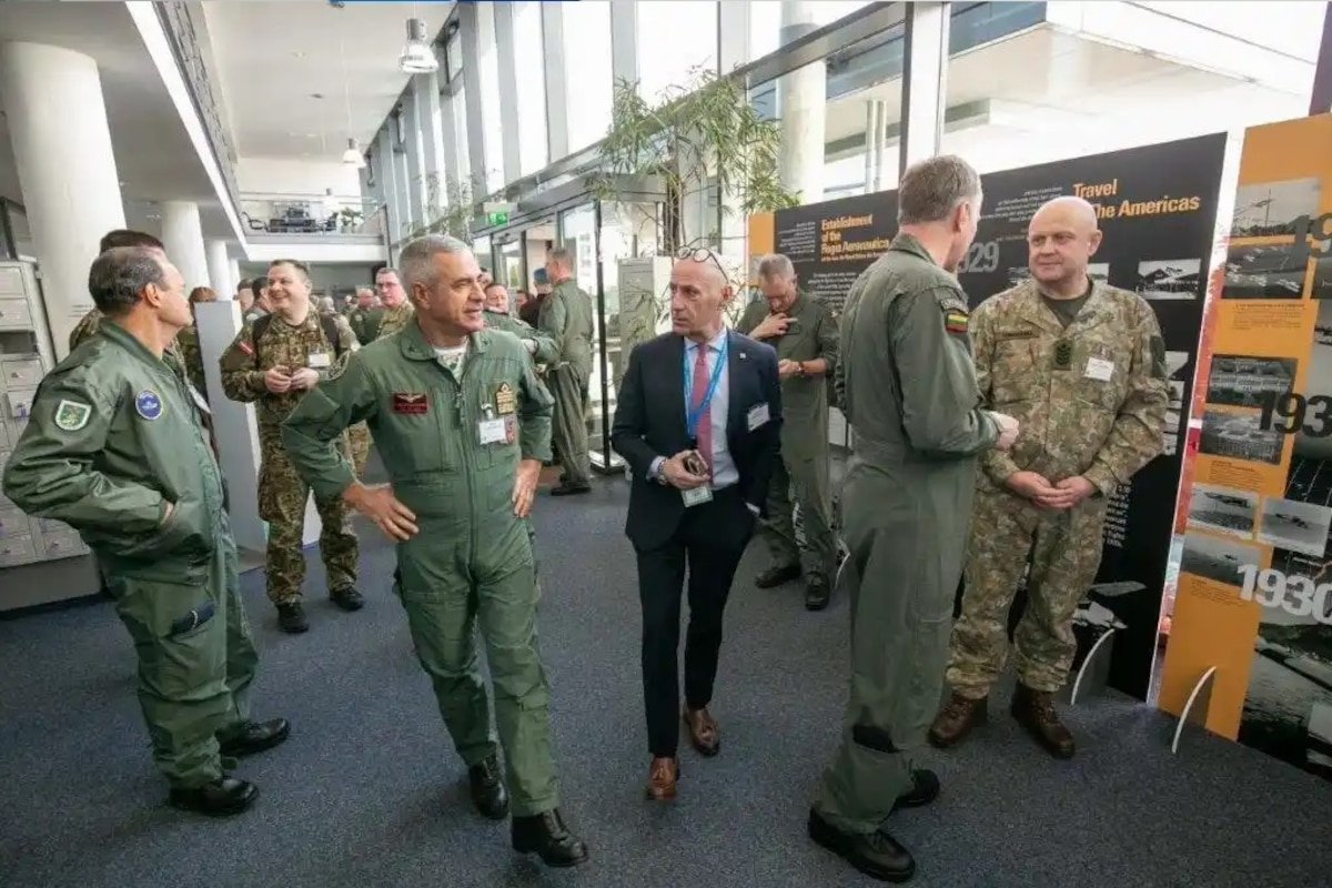 Italian Air Force Deputy Air Chief Lt. Gen. Aurelio Colagrande (second from left) walks through an exhibition on the centenary of the Italian Air Force during the bi-annual NATO Air Chiefs’ Symposium at Ramstein Air Base, Germany, March 16, 2023. Twice each year, the NACS allows all allied and partner Air Chiefs to come together and collaborate on shared success and combined opportunities in the future. (NATO photo by Arnaud Chamberlin)