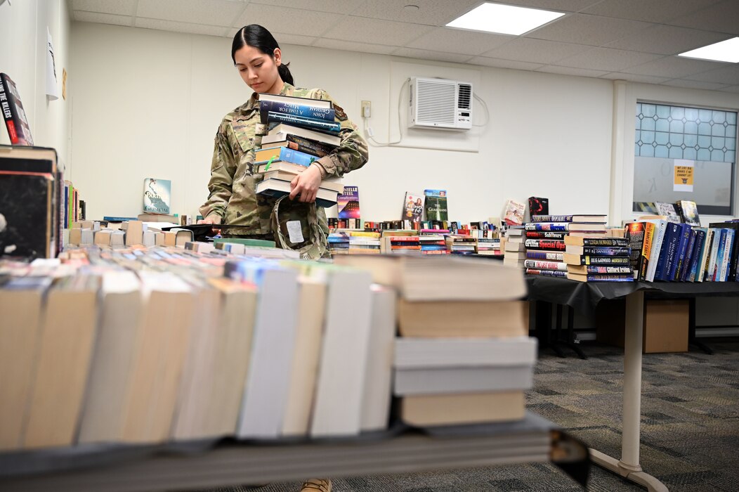 Senior Airman Yolanda Vazquez Jaimes, 433rd Force Support Squadron force management technician, browses a “Pop Up Bookstore” at the 433rd Airmen and Family Readiness Center, March 4, 2023.