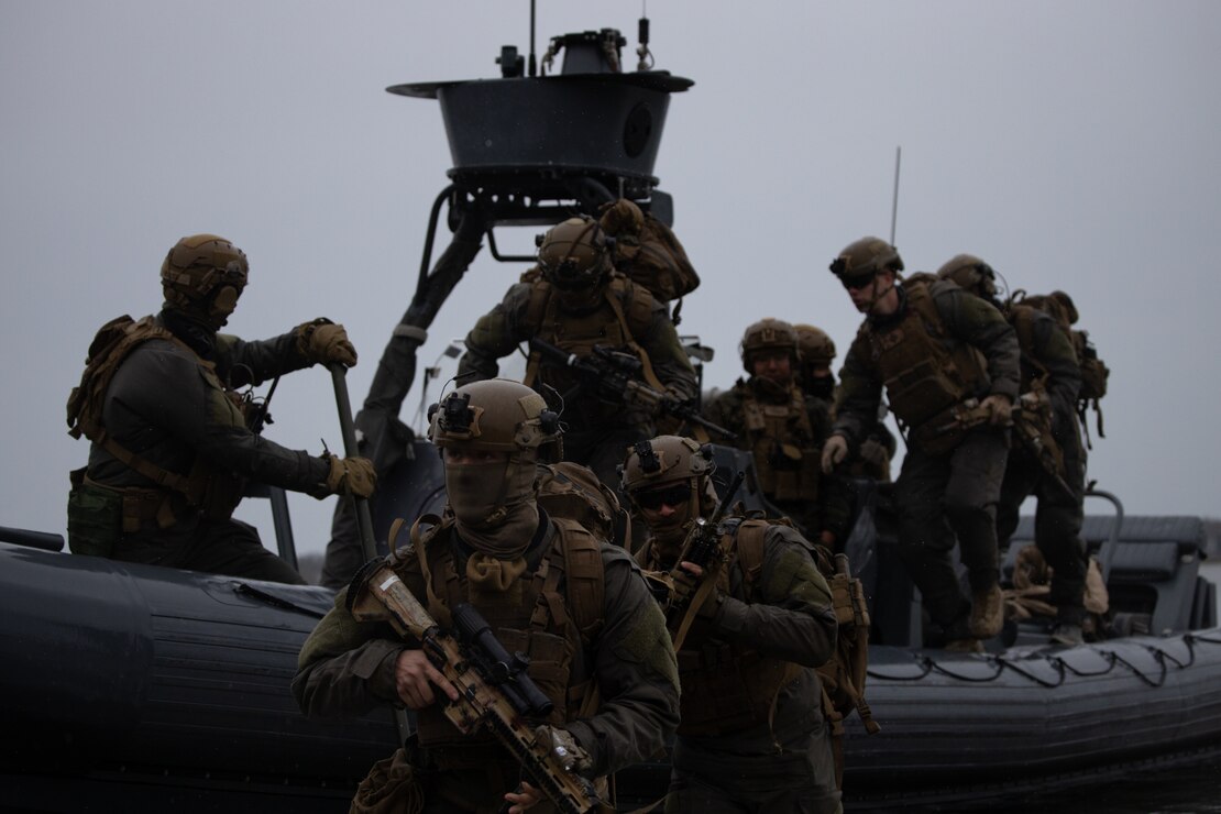 U.S. Marines with Charlie Company, Battalion Landing Team (BLT) 1/6, 26th Marine Expeditionary Unit (MEU) insert via small boats as the raid force in preparation for follow-on operations during MEU Exercise III on Camp Lejeune, North Carolina, March 13, 2023. BLT 1/6 continues to enhance rigid-hulled inflatable boat (RHIB) familiarization and readiness through conducting on and off and shore-to-shore drills prior to deployment. The 11m RHIBs provide the Marine Air-Ground Task Force Commander a high-speed, long –range, low-signature combatant craft capable of projecting and recovering Marines for a variety of missions. (U.S. Marine Corps photo by Cpl. Aziza Kamuhanda)