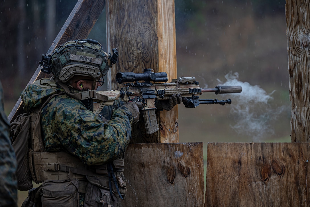 U.S. Marine Corps Lance Cpl. Daniel Nowak, a rifleman with Alpha Company, Battalion Landing Team 1/6, 26th Marine Expeditionary Unit, engages a target with an M27 Infantry Automatic Rifle during a range part of Military Operations in Urban Terrain (MOUT) training on Marine Corps Base Camp Lejeune, North Carolina, March 12, 2023. MOUT training increases the lethality of the MEU’s infantrymen through live-fire drills, room clearing procedures and small team tactics in order to prepare for their upcoming deployment. (U.S. Marine Corps photo by Cpl. Matthew Romonoyske-Bean)