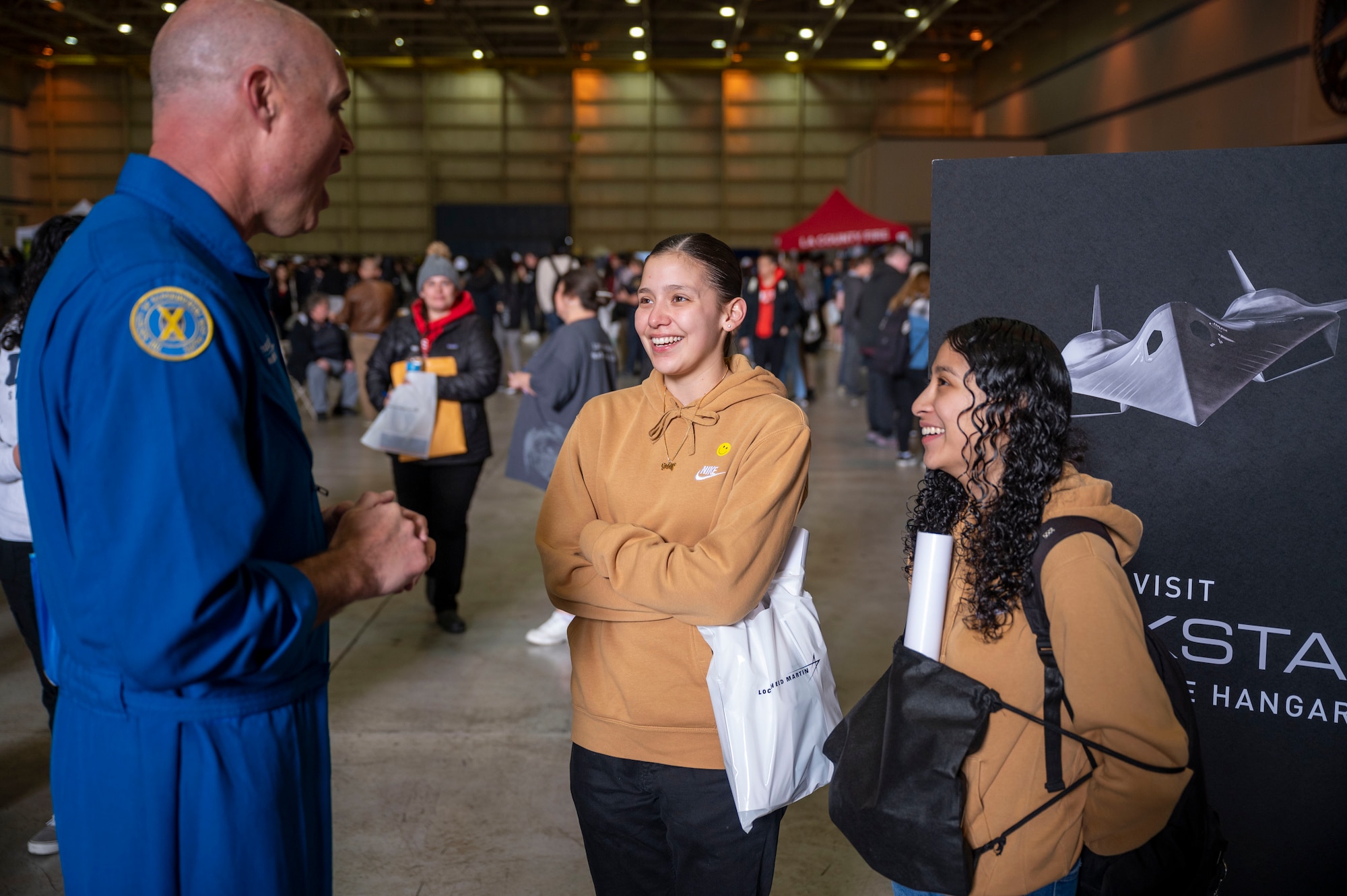 A representative from Lockheed Martin speaks to a group of students at the Aerospace Valley Career Festival, 10 March.