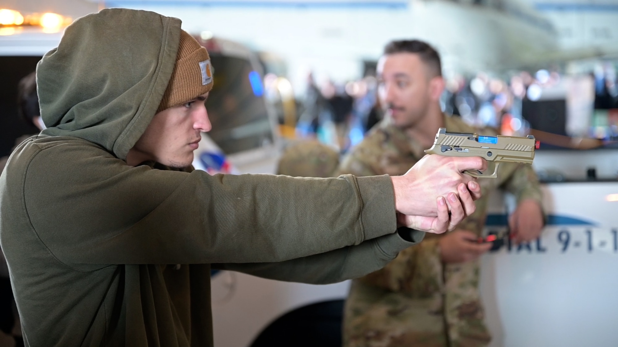 Det. 1 of the 412th Security Forces Squadron teaches a student about law enforcement career fields at the Aerospace Valley Career Festival, 10 March.