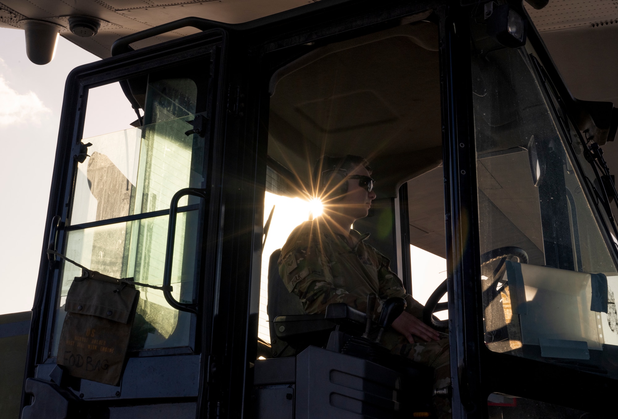 Senior Airman Shayne Paulk, a 921st Contingency Response Squadron aerial port mobility team member, waits to unload a Lockheed C-130 Hercules aircraft for AGILE FLAG 23-1 at Savannah Air National Guard Base, Georgia, Feb. 28. 2023.