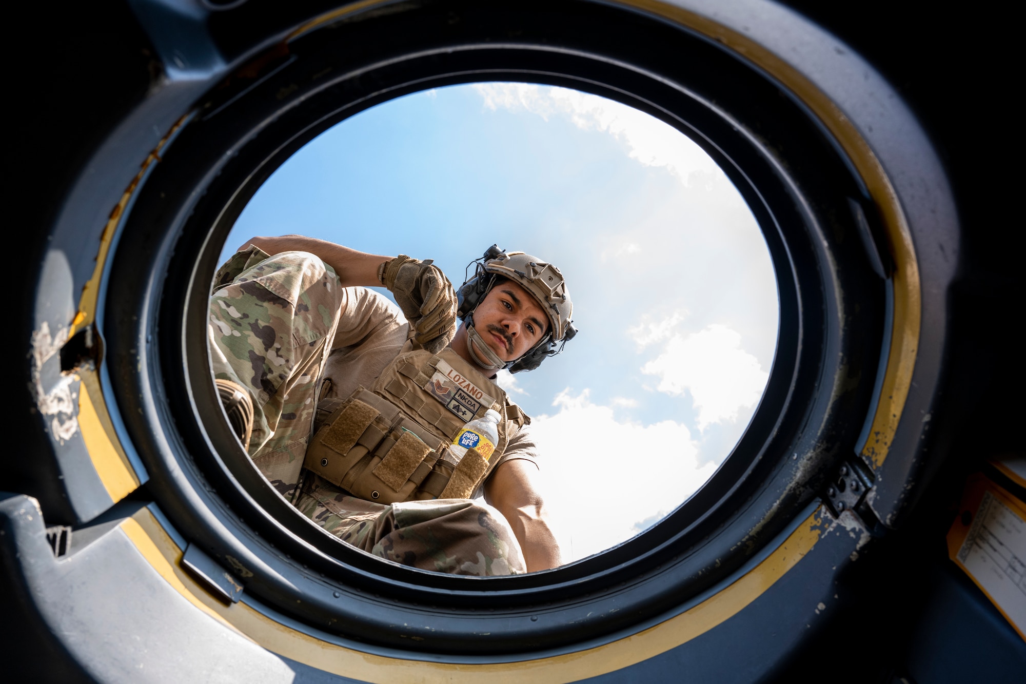 U.S. Air Force Staff Sgt. Cesar Lozano, a 921st Contingency Response Squadron aerial port mobility team member, waits to unload a Lockheed C-130 Hercules aircraft during AGILE FLAG 23-1 at Savannah Air National Guard Base, Georgia, March 7, 2023.