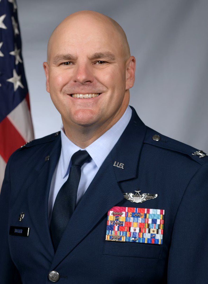 man in uniform poses for a photo