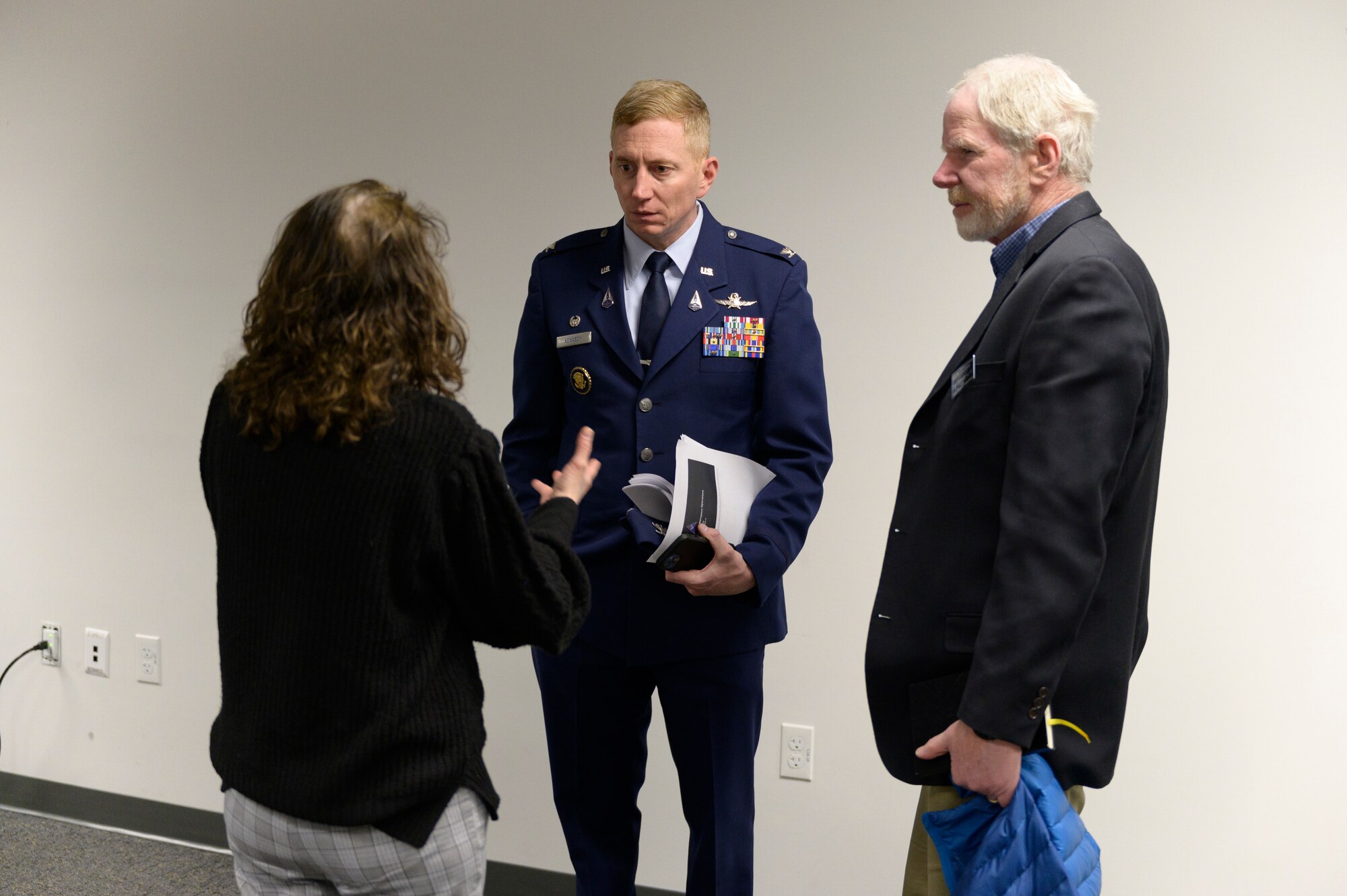 Col. Chris Kennedy, Space Delta 6 commander, speaks with Don Rabern (right), dean of the College of Engineering and Applied Science, and Dr. Lynnane George, senior instructor with the Department of Mechanical and Aerospace Engineering (left), March 16, 2023, at the University of Colorado - Colorado Springs College of Engineering and Applied Science distinguished lecture series. Kennedy provided an overview of the U.S. Space Force, the importance of the Delta 6 cyber operations mission and discussed possible collaboration with the University. The monthly lecture series is dedicated to space cybersecurity and focuses on cutting-edge knowledge and research. (U.S. Space Force photo by Stephen Brady)