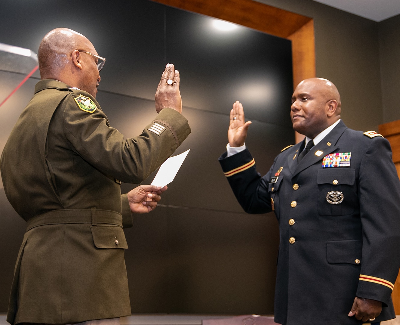 Maj. Gen. Rodney Boyd, Assistant Adjutant General – Army, and Commander of the Illinois Army National Guard, administers the oath of commissioned officers to newly-promoted Maj. Anthony McClain, Security Cooperations Officer, and Director, Diversity, Equity and Inclusion, Illinois National Guard, during a promotion ceremony March 17 at the Illinois Military Academy on Camp Lincoln, Springfield, Illinois.