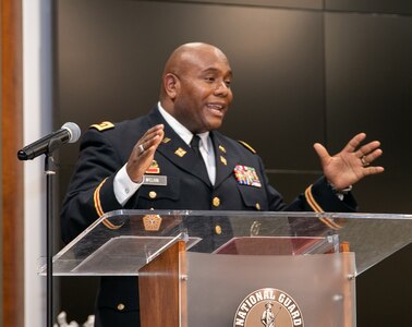 Newly promoted Illinois Army National Guard Maj. Anthony McClain, of Springfield, thanks family and friends for their support throughout his 27-year military career, during a promotion ceremony March 17 at the Illinois Military Academy at Camp Lincoln, Springfield, Illinois.