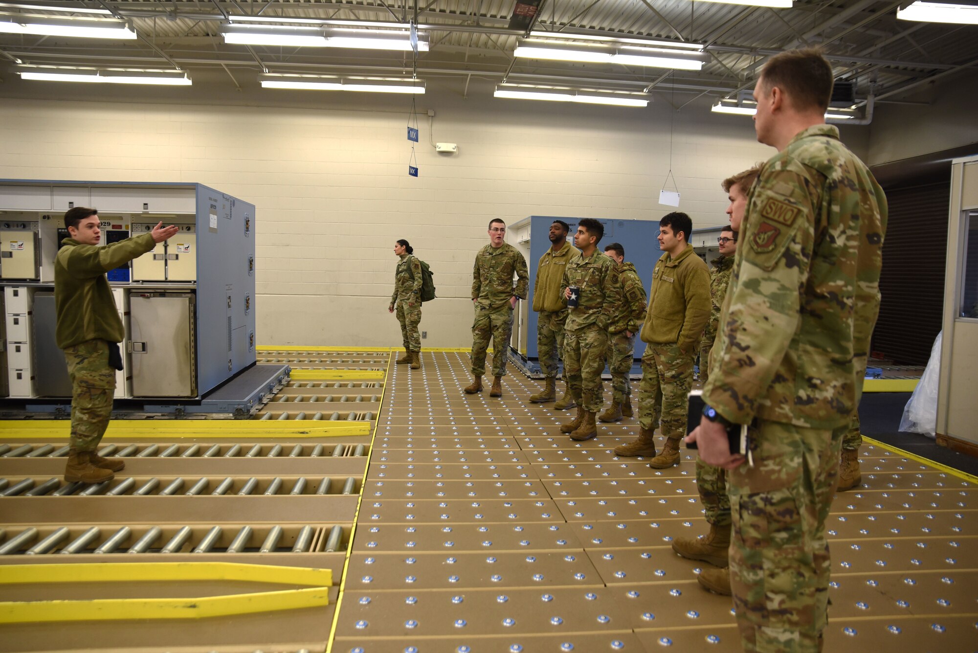 Team McChord Airmen learn about aircraft supply as a part of the Airmen Experience tour at Joint Base Lewis-McChord, Washington, March 14, 2023. The Airmen Experience  is a two-day tour held once a month that allows new Airmen to integrate into their new command by showing them how their units contribute to the mission. (U.S. Air Force Photo by Airman Kylee Tyus)