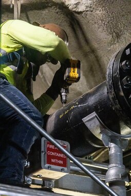 A contractor conducts a repair on a fuel pipe at Red Hill Bulk Fuel Storage Facility (RHBFSF), Halawa, Hawaii, Mar. 6, 2023. Joint Task Force-Red Hill is currently in phase three of its five-phase defueling plan, where contractors and employees will be completing repairs and upgrades which will ensure a safe and expeditious defueling of the RHBFSF. (U.S. Marine Corps photo by Sgt. Sarah Stegall)